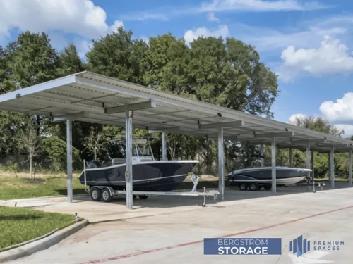 two boats parked under covered storage at bergstrom storage